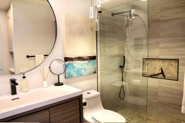 a bathroom with a sink toilet and shower