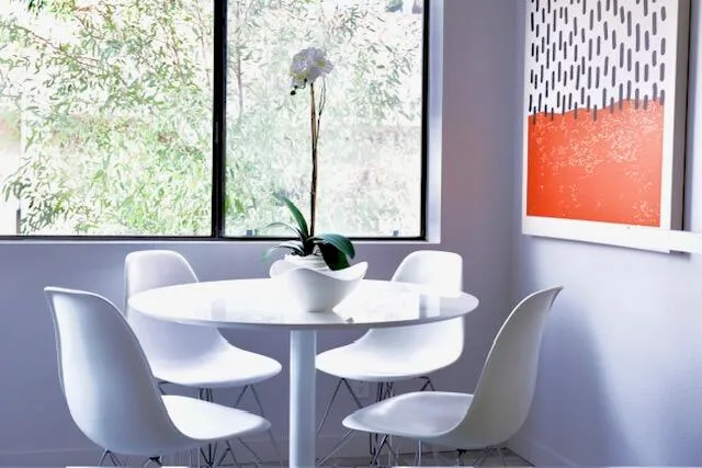 a view of a dining room with furniture window and outside view
