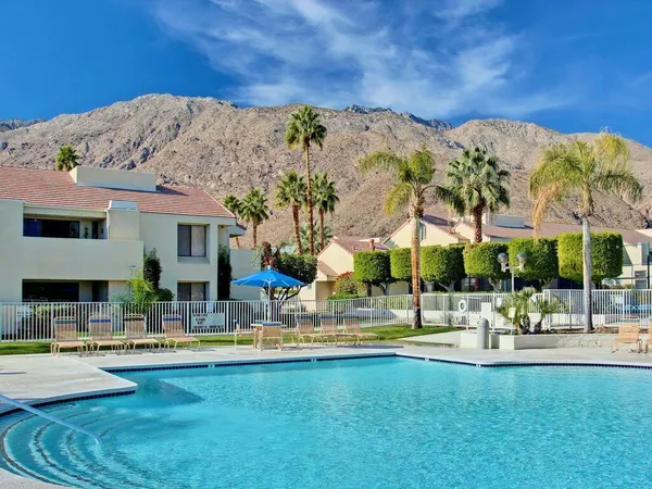 a view of swimming pool with outdoor seating