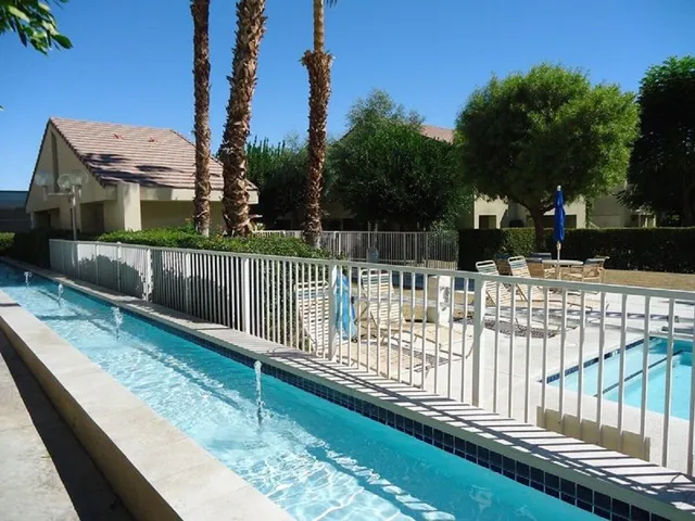 a view of balcony with wooden fence