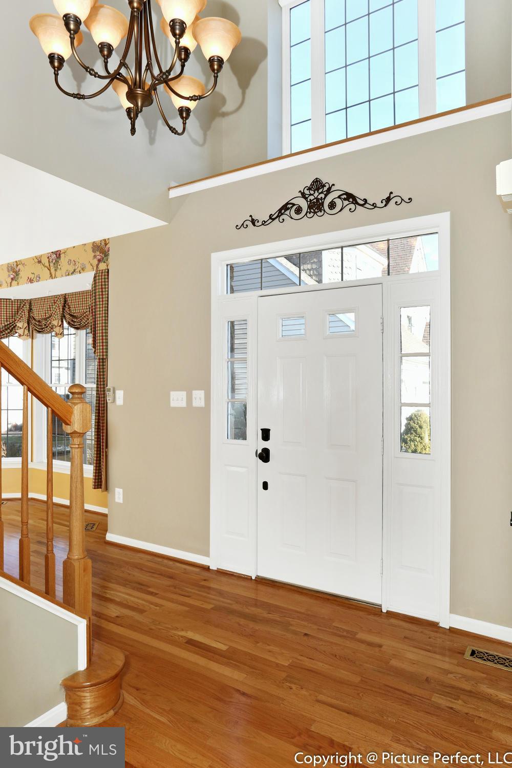 2557 Bear Den Road Frederick, MD 21701 - Photo 2 of 30 a view of a room with wooden floor and cabinet