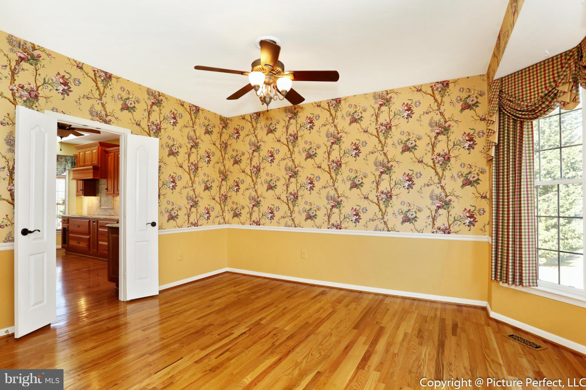 2557 Bear Den Road Frederick, MD 21701 - Photo 12 of 30 a view of a hallway with wooden floor and a large window