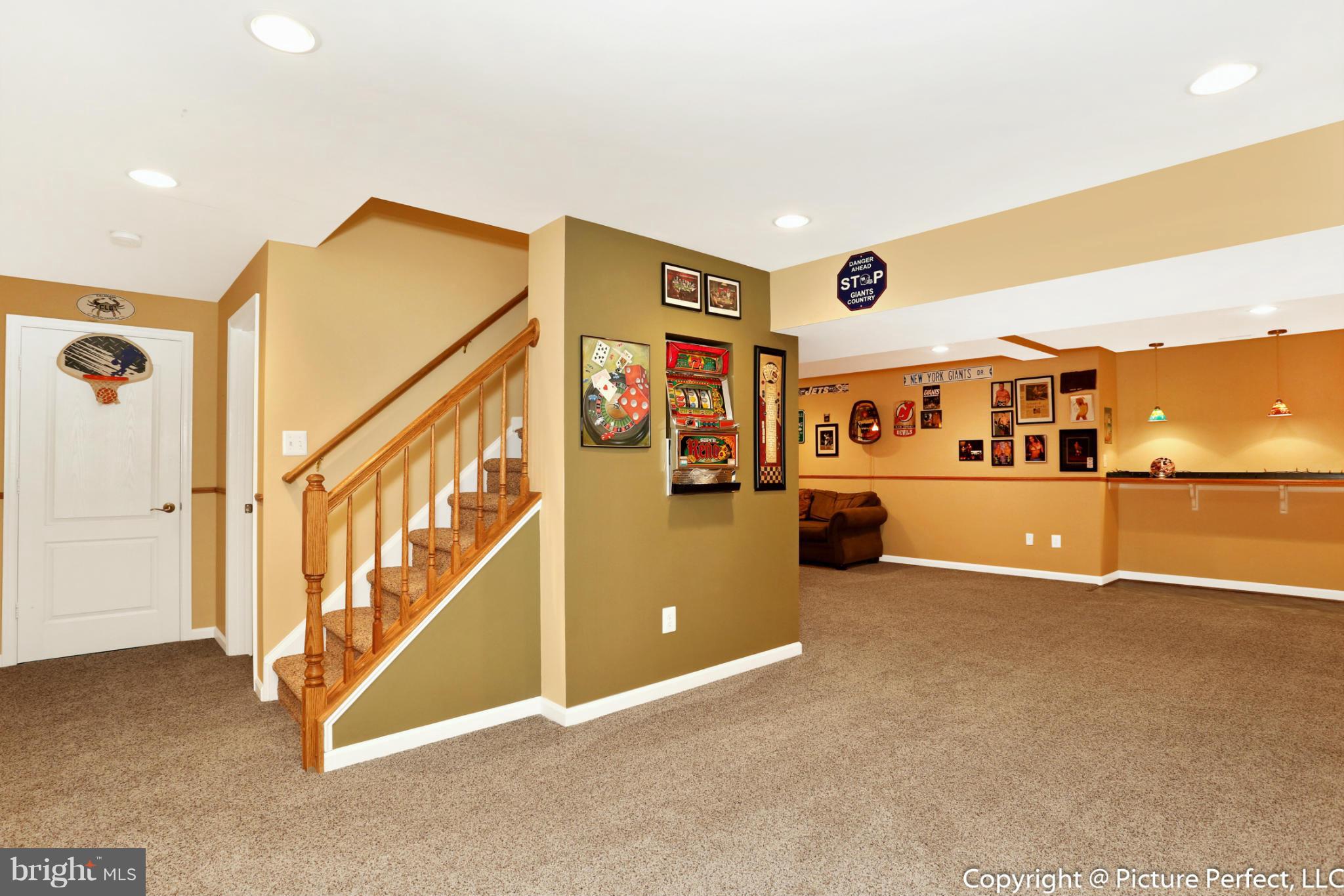 2557 Bear Den Road Frederick, MD 21701 - Photo 22 of 30 a view of a living room with furniture and a kitchen