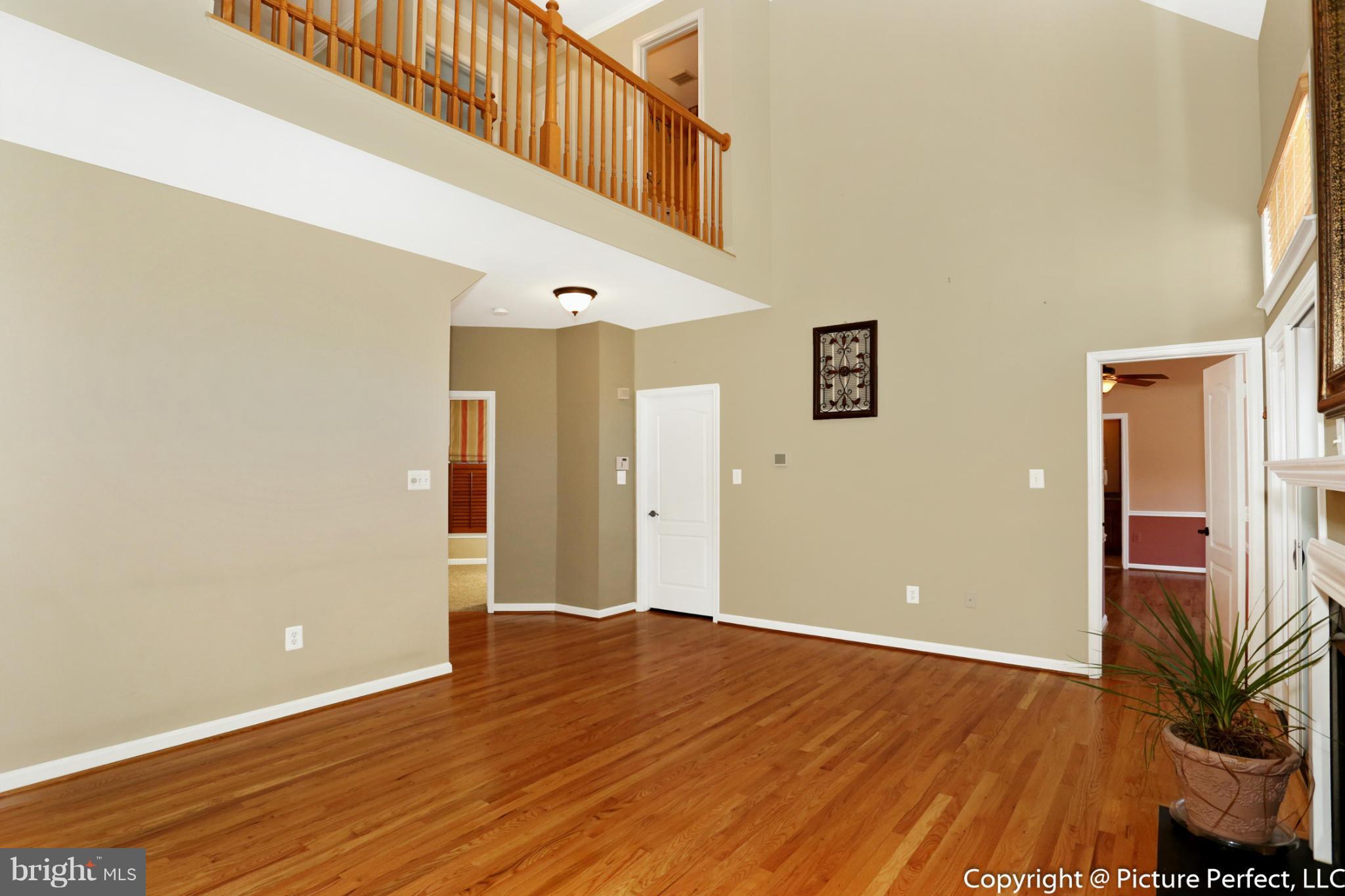 2557 Bear Den Road Frederick, MD 21701 - Photo 9 of 30 a view of an empty room with wooden floor