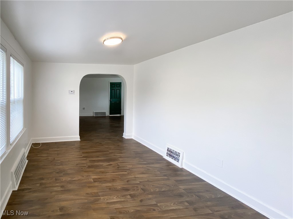 14628 Granger Road Maple Heights, OH 44137 - Photo 8 of 45 Empty room featuring dark hardwood / wood-style flooring