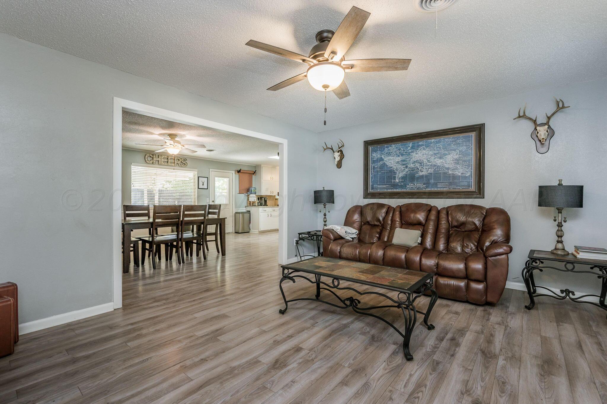 6010 Elmhurst Road Amarillo, TX 79106 - Photo 3 of 19 a living room with furniture and a wooden floor