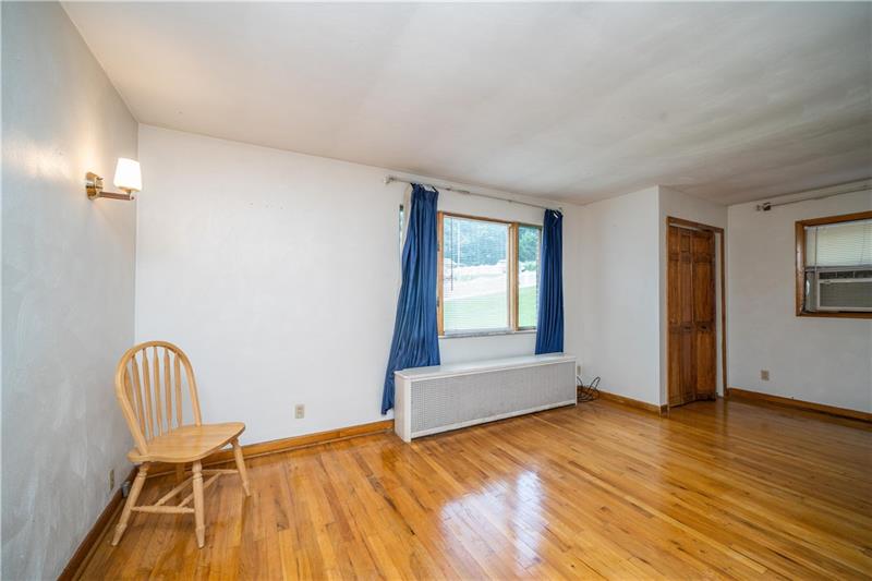 170 Churchill Road Turtle Creek, PA 15145 - Photo 14 of 25 Enjoy a large window & stunning hardwood floors, too!