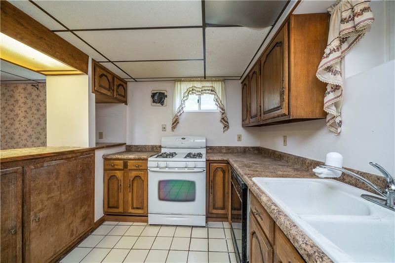 170 Churchill Road Turtle Creek, PA 15145 - Photo 9 of 25 Tiled breakfast bar is a great spot for quick meals.