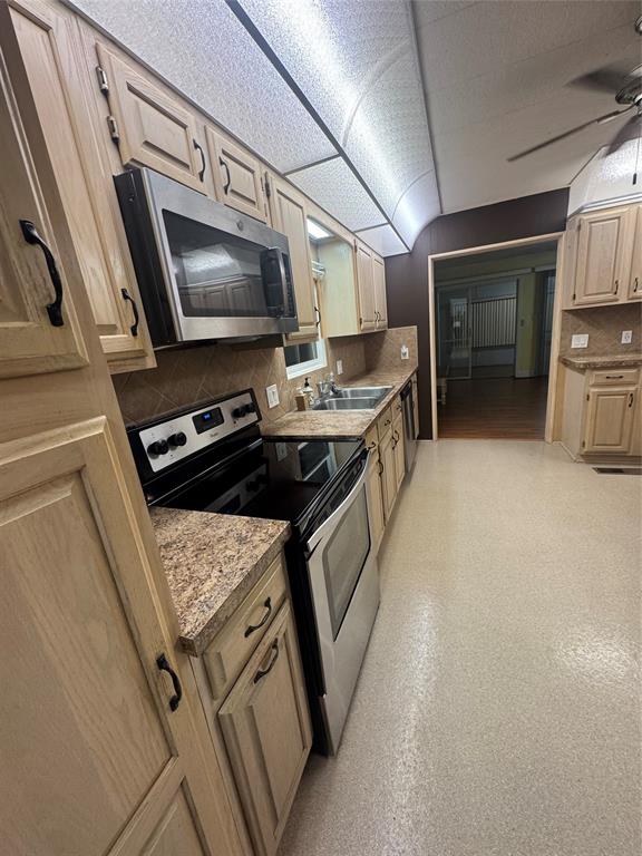 1921 Southwest 83rd Avenue Davie, FL 33324 - Photo 13 of 30 a kitchen that has a sink and a stove