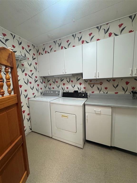 1921 Southwest 83rd Avenue Davie, FL 33324 - Photo 15 of 30 a utility room with cabinets washer and dryer