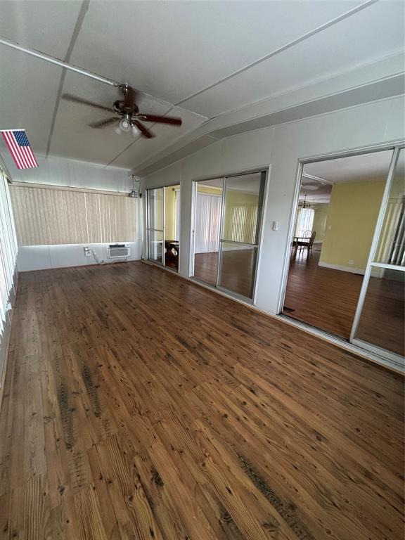 1921 Southwest 83rd Avenue Davie, FL 33324 - Photo 18 of 30 wooden floor in an empty room with a window
