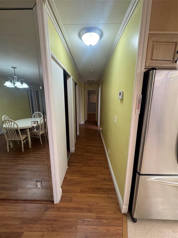 1921 Southwest 83rd Avenue Davie, FL 33324 - Photo 20 of 30 a view of a hallway with wooden floor and staircase