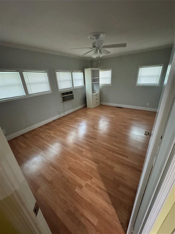 1921 Southwest 83rd Avenue Davie, FL 33324 - Photo 22 of 30 a view of empty room with wooden floor and fan