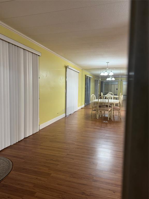 1921 Southwest 83rd Avenue Davie, FL 33324 - Photo 5 of 30 a view of a livingroom with furniture wooden floor and a kitchen