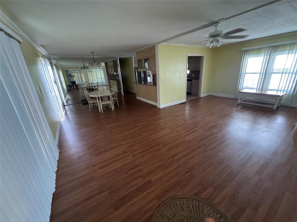 1921 Southwest 83rd Avenue Davie, FL 33324 - Photo 10 of 30 an empty room with wooden floor and windows