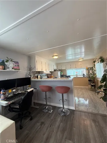 a room with furniture and a wooden floor