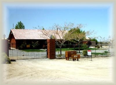 11576 Desert View Road Pinon Hills, CA 92372 - Photo 1 of 1 a view of house with outdoor space and sitting area