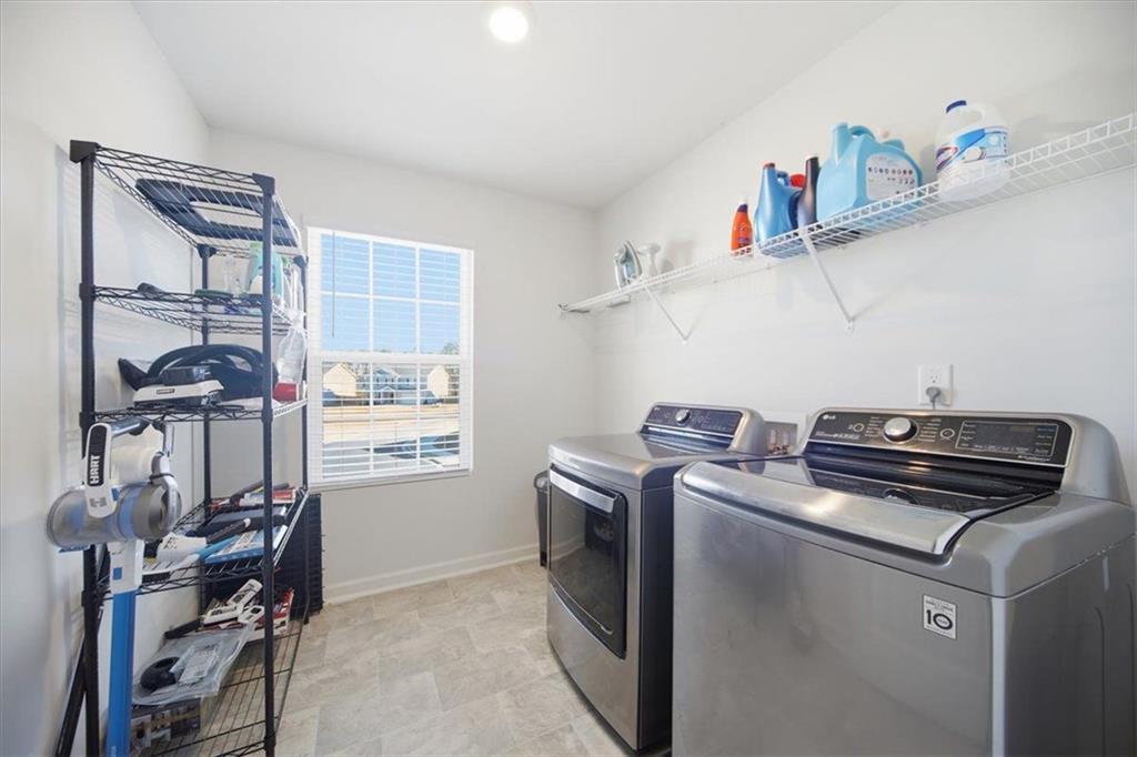 7946 Hansell Court Lithia Springs, GA 30122 - Photo 24 of 58 a utility room with dryer and washer