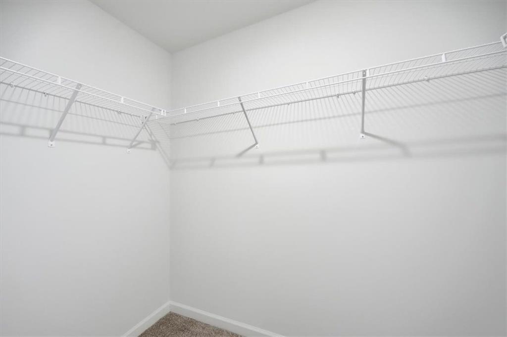 7946 Hansell Court Lithia Springs, GA 30122 - Photo 34 of 58 a view of a room with racks on the wall