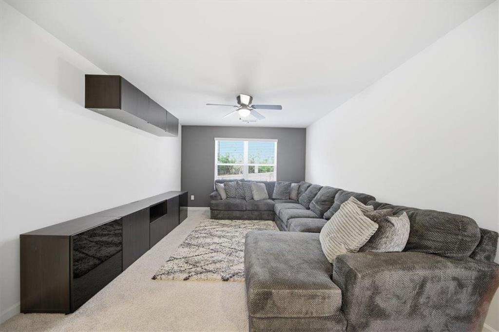 7946 Hansell Court Lithia Springs, GA 30122 - Photo 35 of 58 a living room with furniture and a window