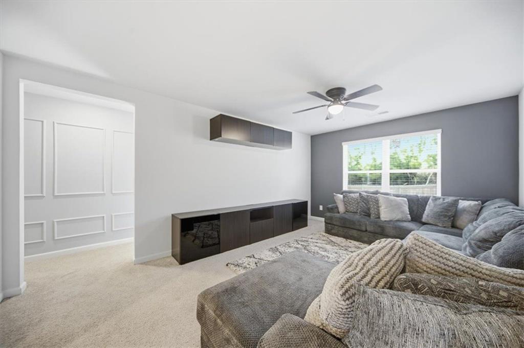 7946 Hansell Court Lithia Springs, GA 30122 - Photo 37 of 58 a bedroom with a bed and window