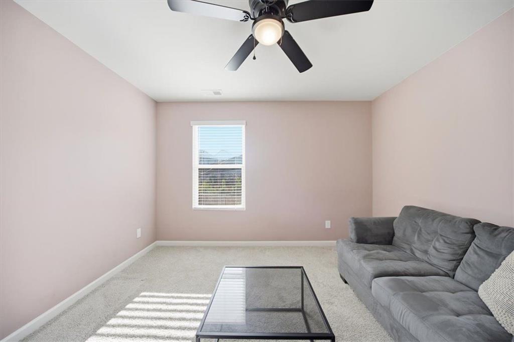 7946 Hansell Court Lithia Springs, GA 30122 - Photo 39 of 58 a living room with furniture and window