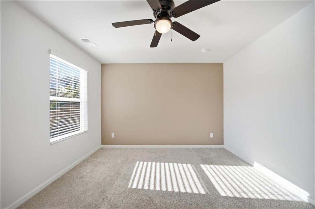 7946 Hansell Court Lithia Springs, GA 30122 - Photo 41 of 58 a view of an empty room with a window