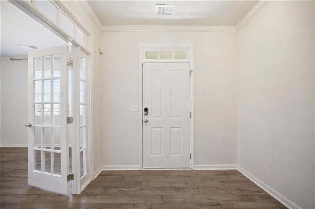 7946 Hansell Court Lithia Springs, GA 30122 - Photo 5 of 58 wooden floor in an empty room