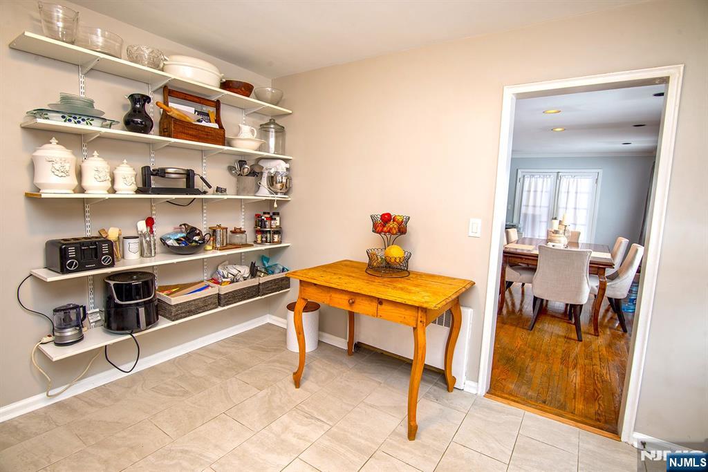 314 Valley Road Haworth, NJ 07641 - Photo 6 of 15 a room with stainless steel appliances lots of furniture and a wooden floor