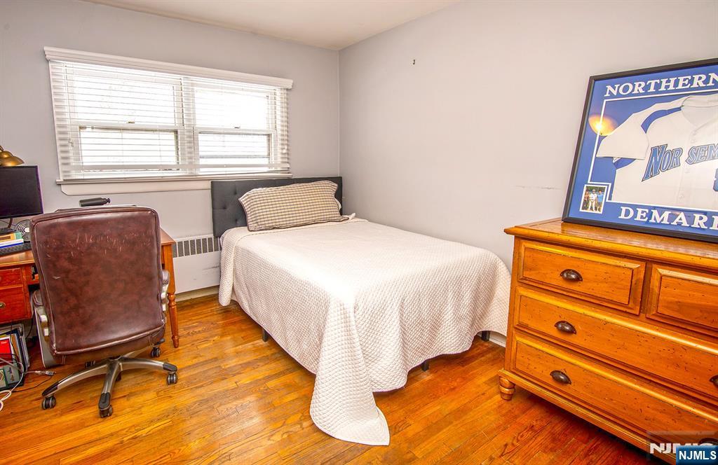 314 Valley Road Haworth, NJ 07641 - Photo 9 of 15 a bedroom with a bed and chair