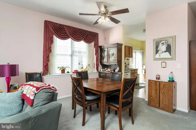 a dining room with furniture and window