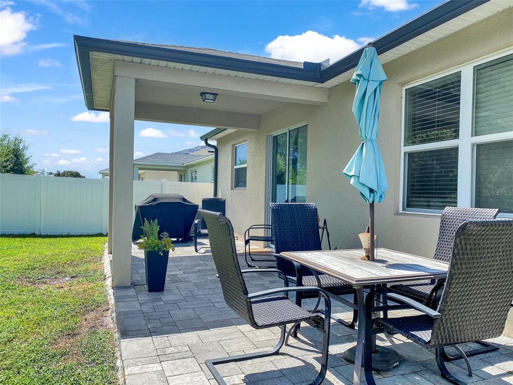 4548 Orchard Grove Road St. Cloud, FL 34772 - Photo 3 of 18 a view of a dining room with furniture and chandelier