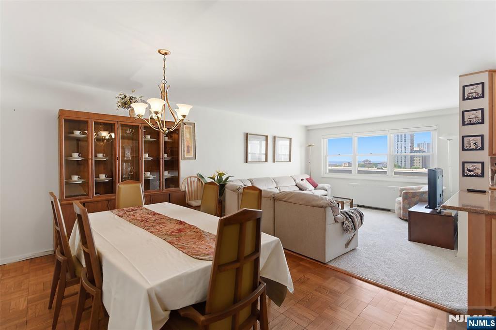 280 Prospect Avenue, Unit 8G Hackensack, NJ 07601 - Photo 13 of 23 a view of a dining room with furniture and chandelier