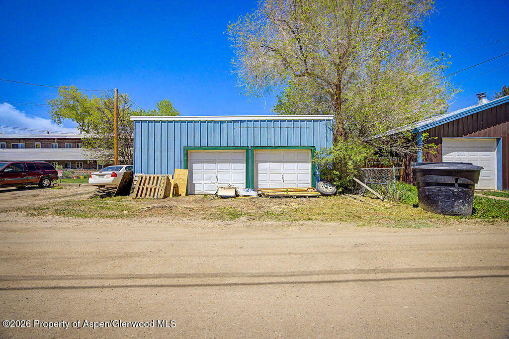 625 Russell Street Craig, CO 81625 - Photo 29 of 35 a view of a house with a yard and sitting area
