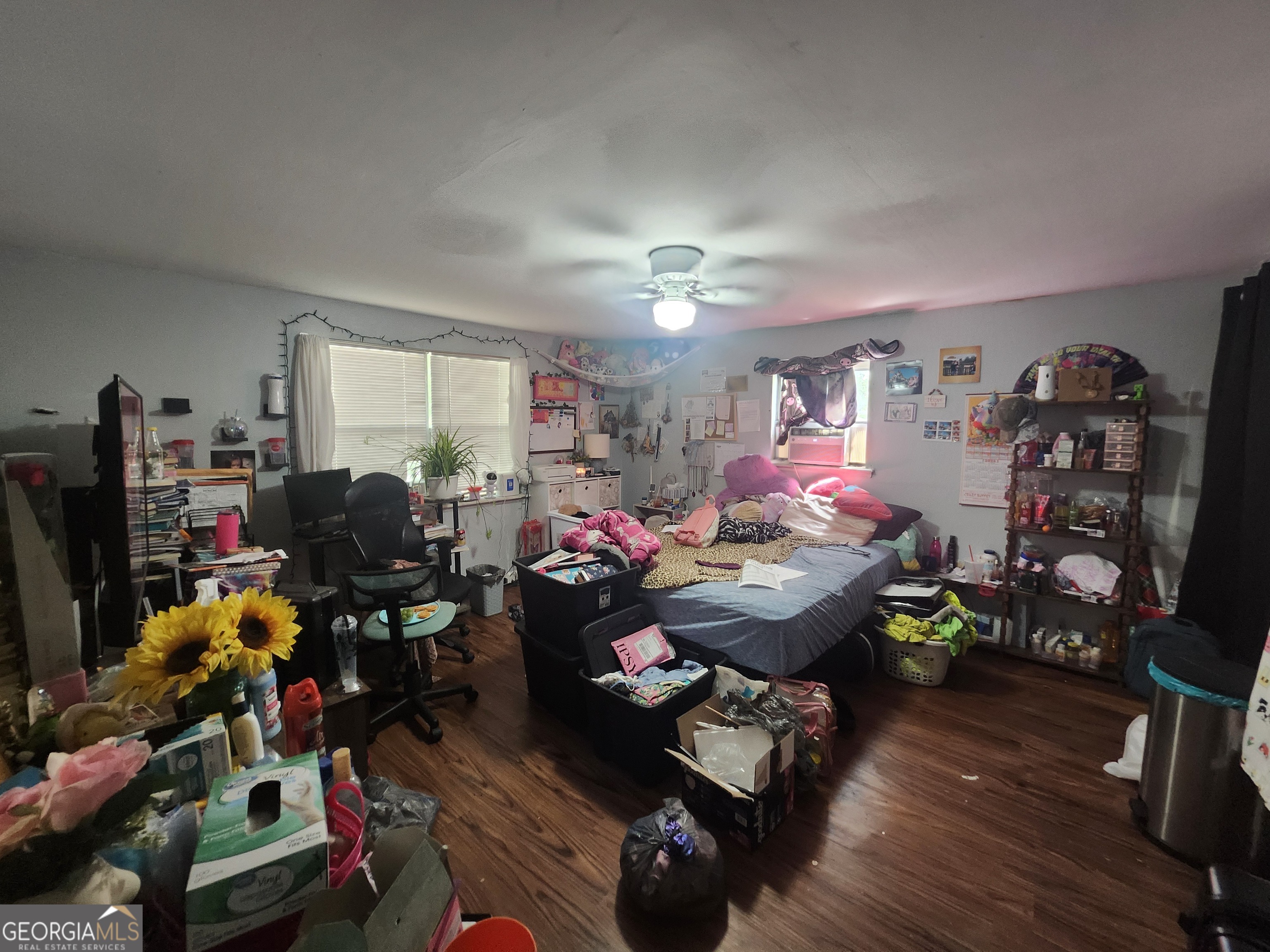 2101 South Madison Street Albany, GA 31701 - Photo 18 of 21 a living room filled with furniture and a wooden floor