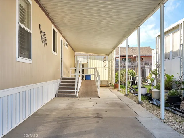 a view of a porch with wooden floor and stairs
