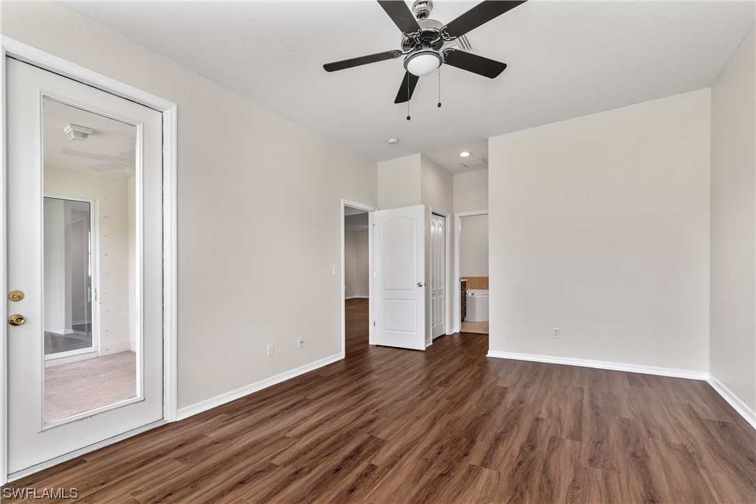 12713 Stone Tower Loop Fort Myers, FL 33913 - Photo 21 of 44 wooden floor in an empty room with a window