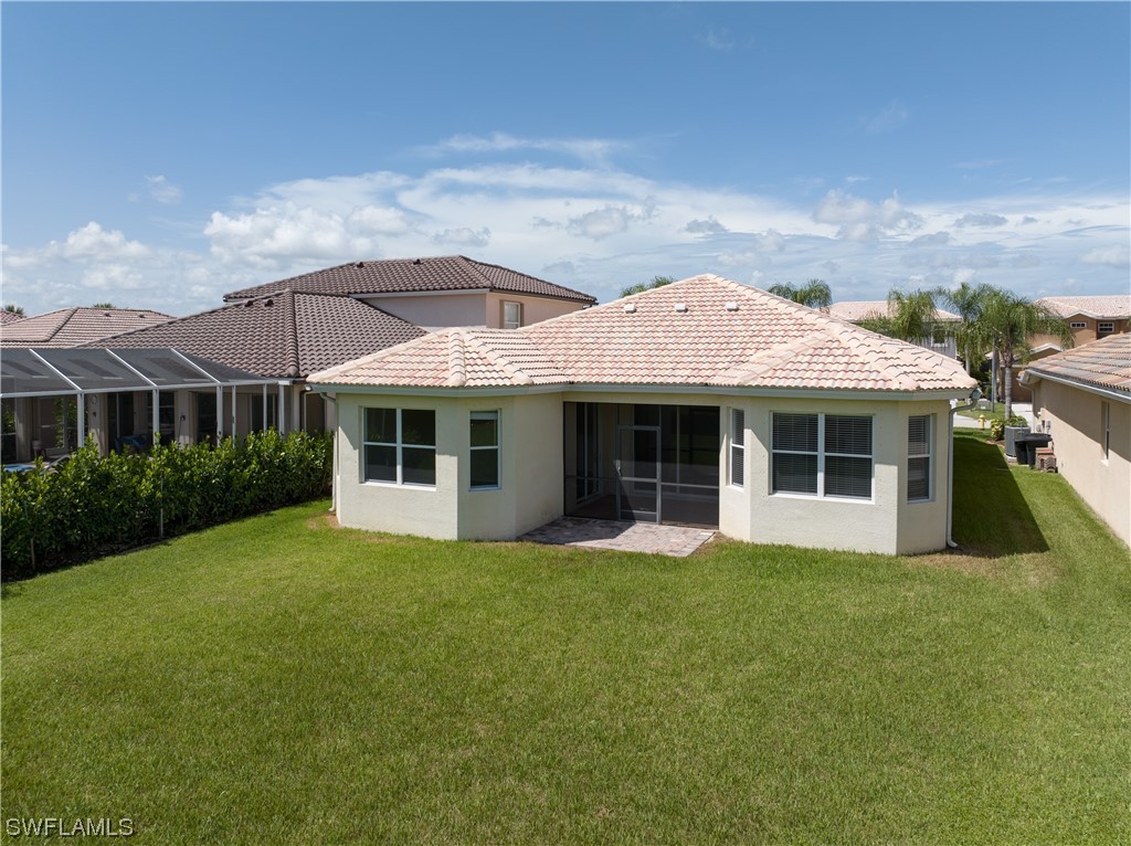 12713 Stone Tower Loop Fort Myers, FL 33913 - Photo 33 of 44 a front view of a house with a garden and porch