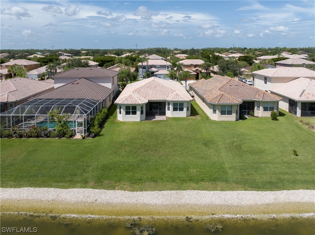 12713 Stone Tower Loop Fort Myers, FL 33913 - Photo 36 of 44 an aerial view of residential houses with outdoor space and lake view