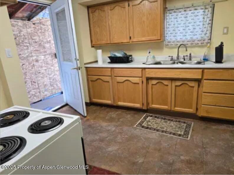 26 Le Blanc Road Craig, CO 81625 - Photo 3 of 3 a kitchen with a sink a stove and cabinets