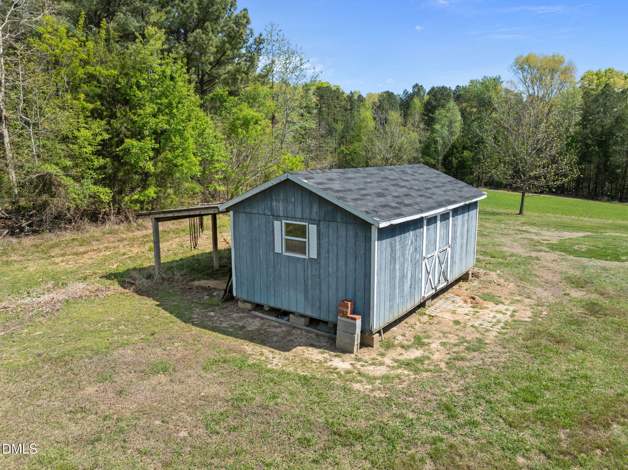 236 Dirgie Mine Road Roxboro, NC 27574 - Photo 44 of 55 a view of a house with backyard and trees