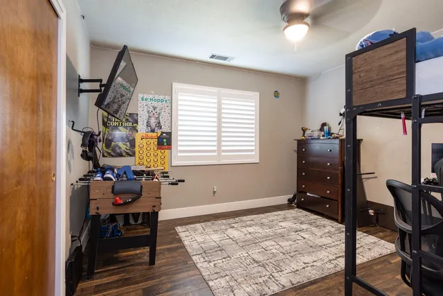a bedroom with furniture and a window