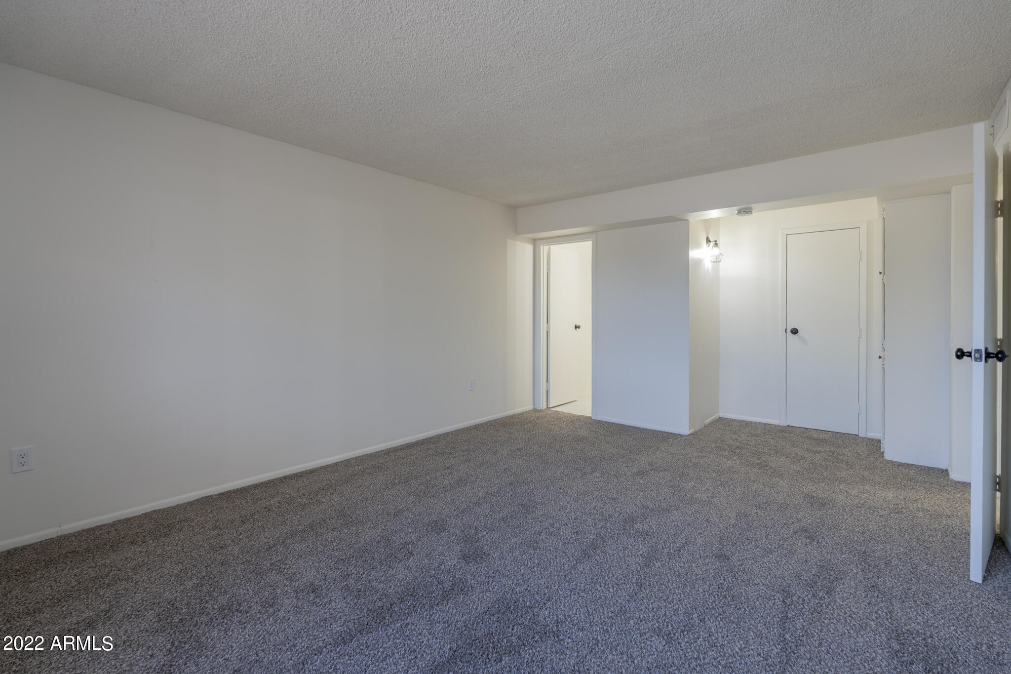 9833 West Royal Ridge Drive Sun City, AZ 85351 - Photo 15 of 20 Primary Suite