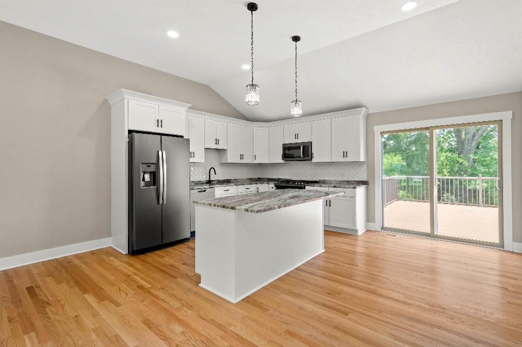 28 Seneca Road Pittsburgh, PA 15241 - Photo 8 of 24 a kitchen with stainless steel appliances granite countertop a refrigerator a sink dishwasher a stove and white countertops with wooden floor
