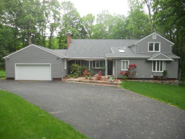 15 Cassway Road Woodbridge, CT 06525 - Photo 1 of 1 a view of a house with a yard and large tree
