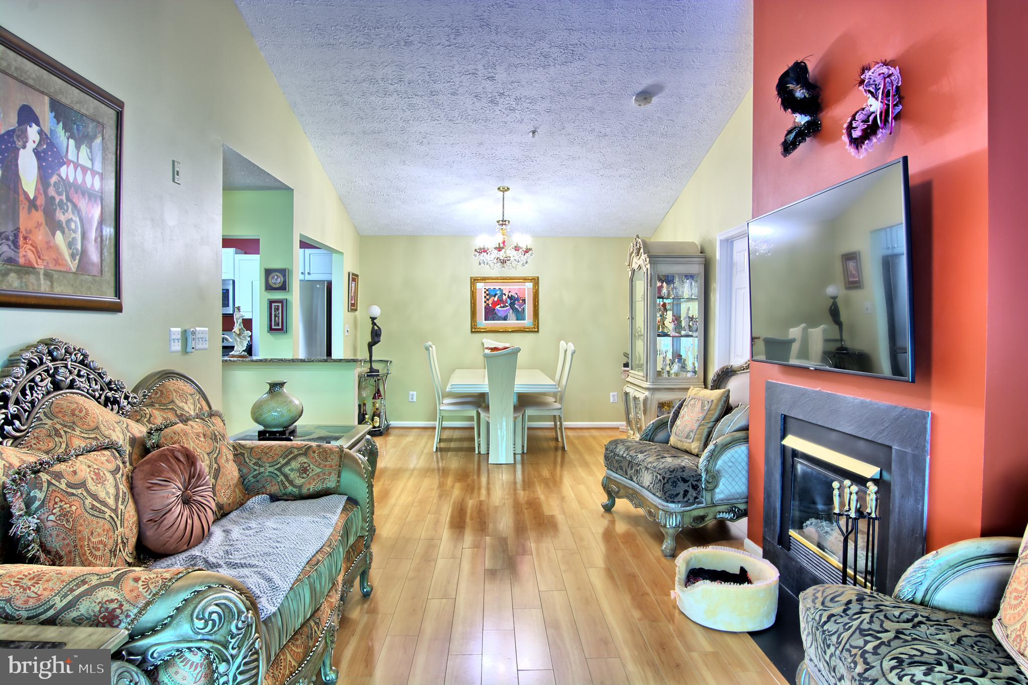 534 Kennington Road, Unit 534 Reisterstown, MD 21136 - Photo 6 of 19 a living room with fireplace furniture and a wooden floor