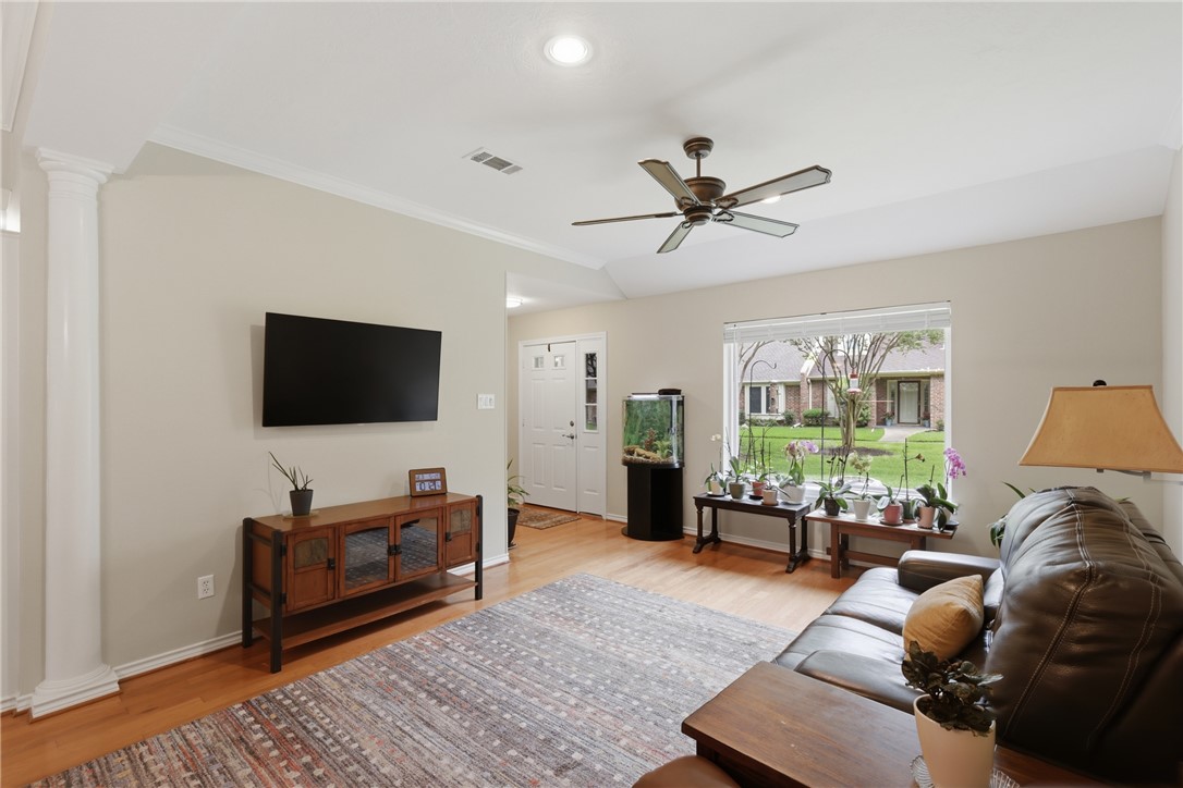 1520 Bennett Street Bryan, TX 77802 - Photo 7 of 24 a living room with furniture and a flat screen tv