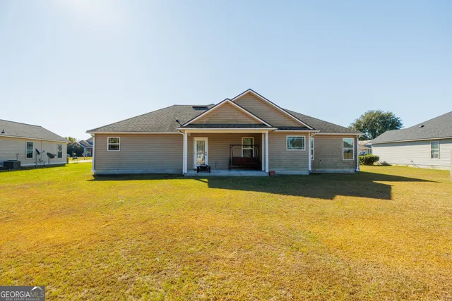 a front view of a house with swimming pool