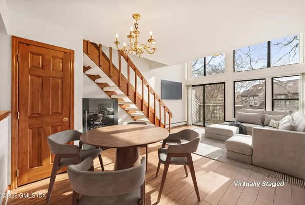 a view of a balcony with wooden fence and floor
