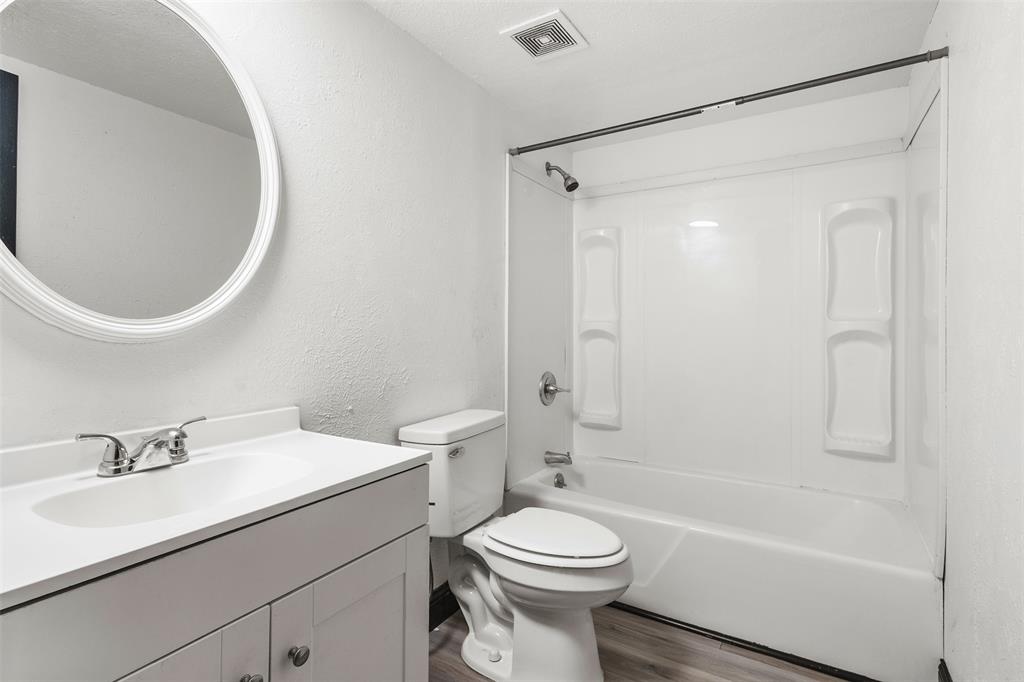 2802 Spring Valley Drive Bedford, TX 76021 - Photo 19 of 24 a bathroom with a sink toilet and shower